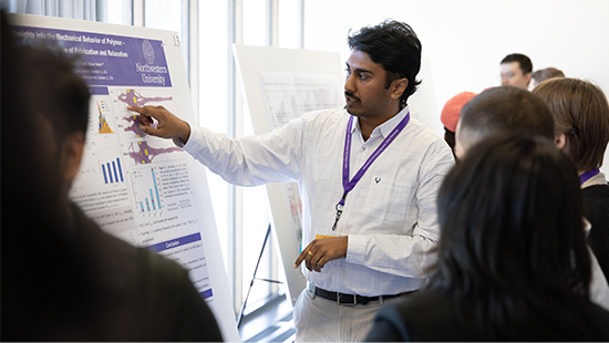 Participants discussing poster.